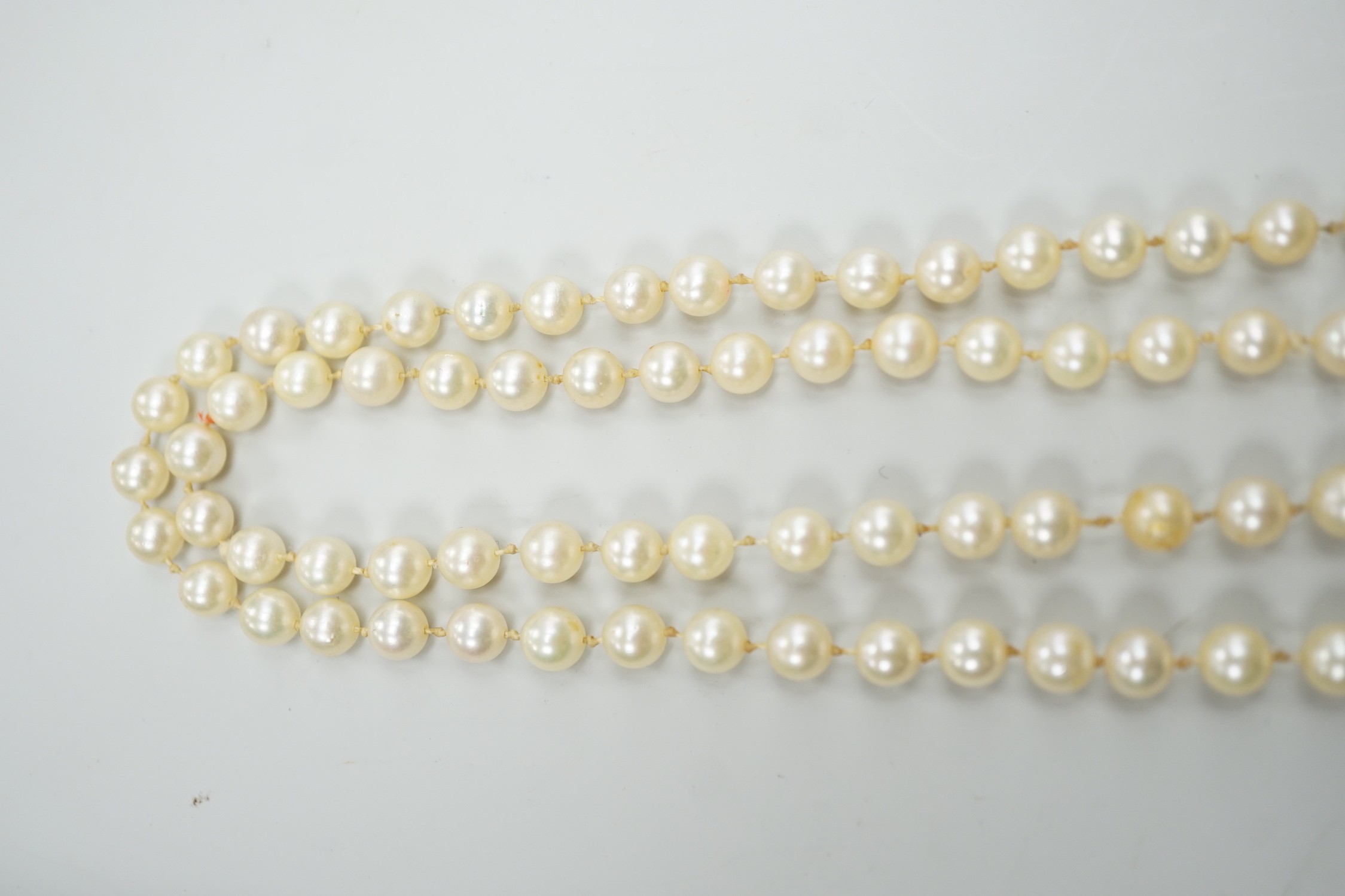 A single strand cultured pearl necklace, with 9ct white gold and diamond chip set clasp, 80cm.